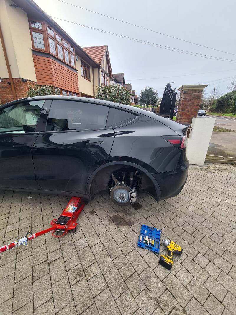 Mobile puncture repair on a Tesla in Brentwood, Essex, with the wheel removed for inspection and repair.