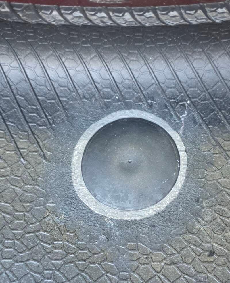 Internal tyre puncture plug repair patch fitted to the inside of a car tyre.