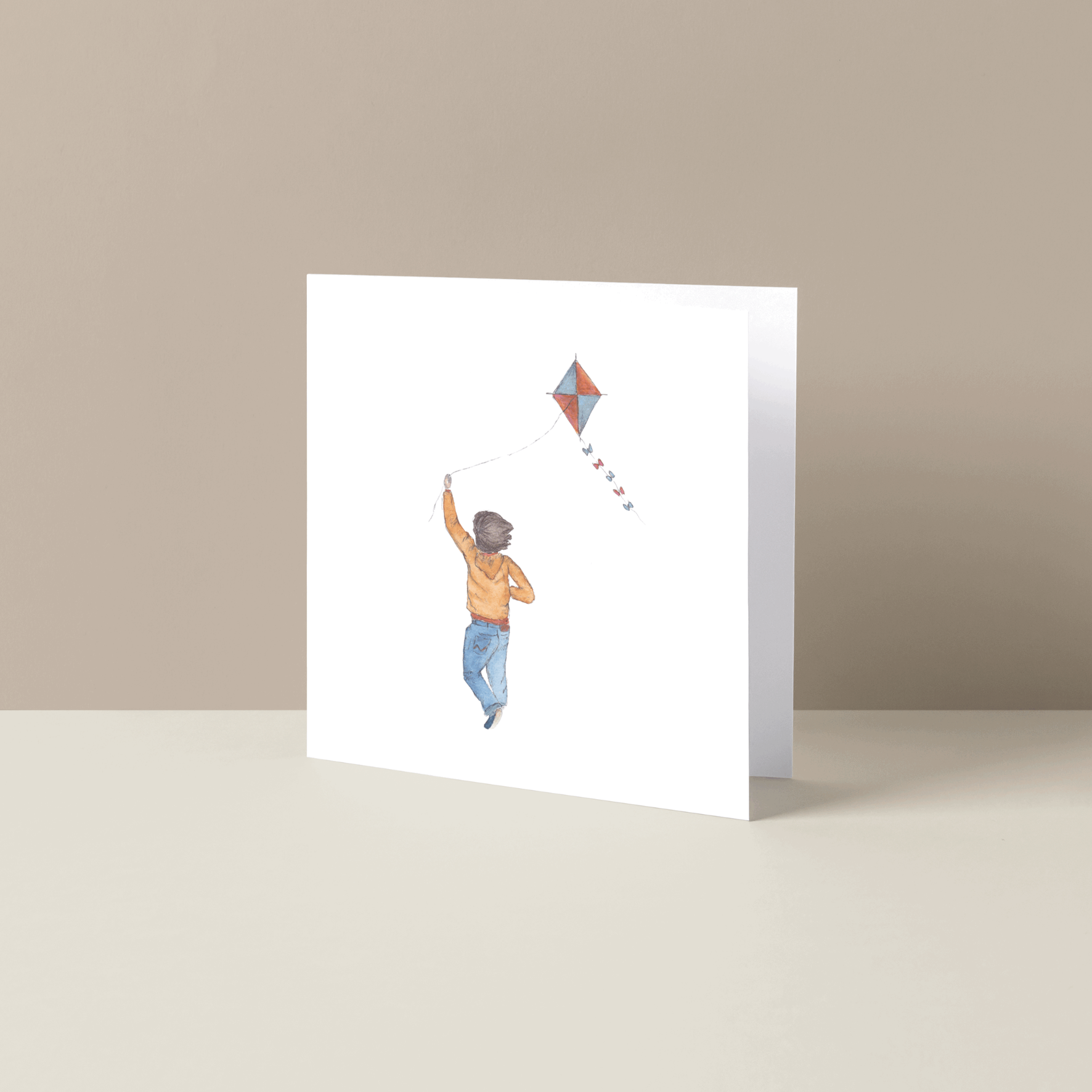 Gevouwen wenskaart jongen met vlieger