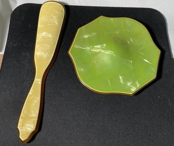 Celluloid vanity set pieces with gold trim