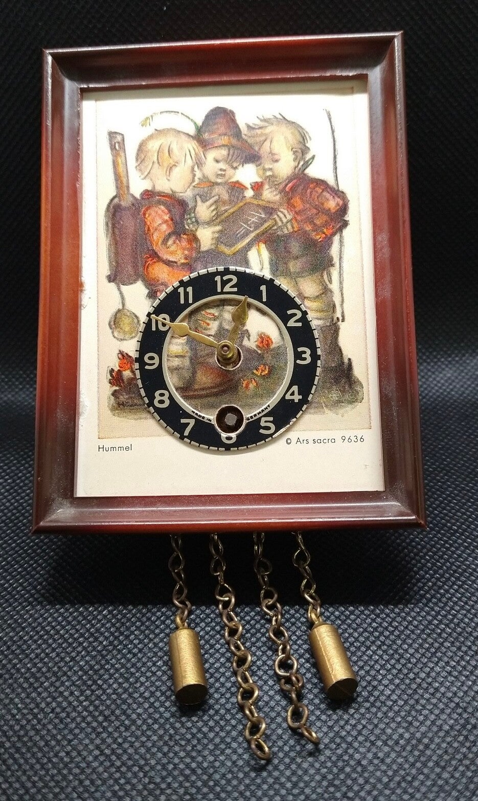 Wooden miniature clock titled "School Children" by Ars Sacra
