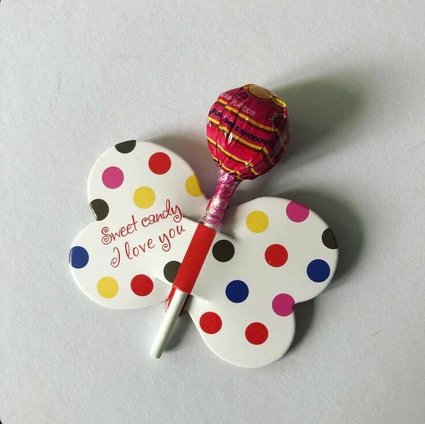 Vlinder met lolly traktatie