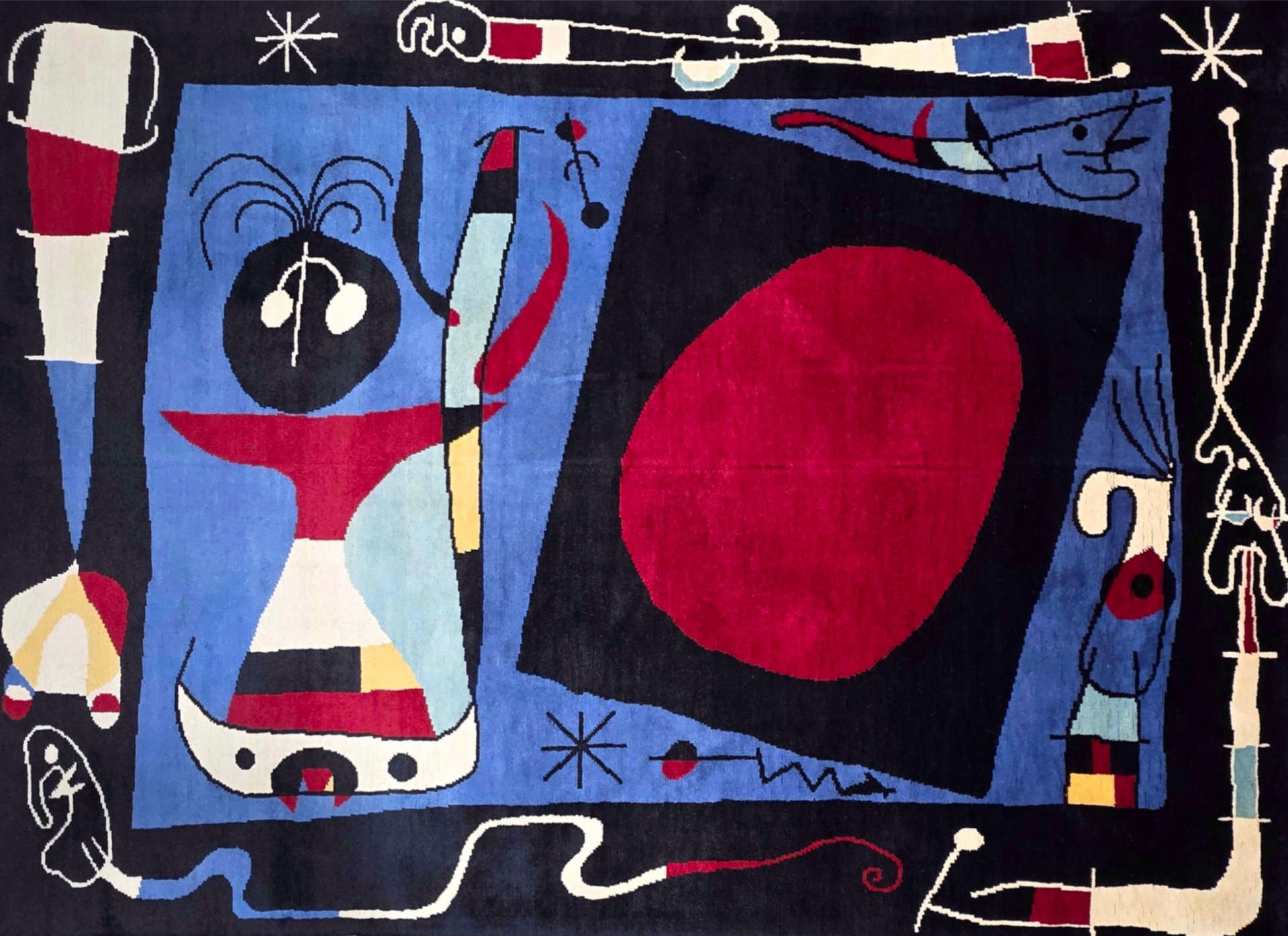 Tapis Joan Miro 265x180 bleu noué en laine
