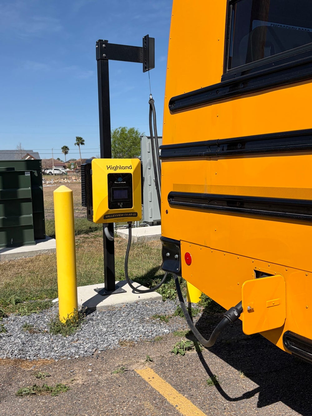 Commercial EV charging station connected to an electric school bus at a VDZ Electrical Services project