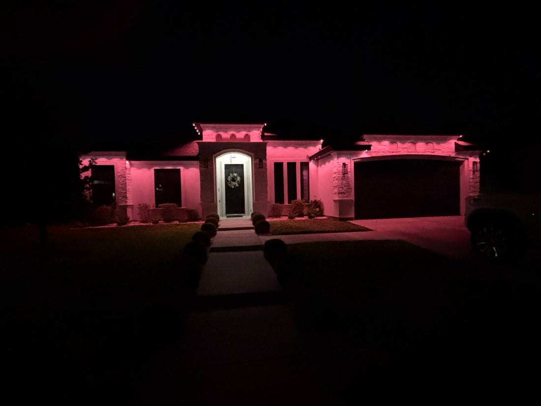 Home illuminated with pink exterior accent lighting at a VDZ Electrical Services project