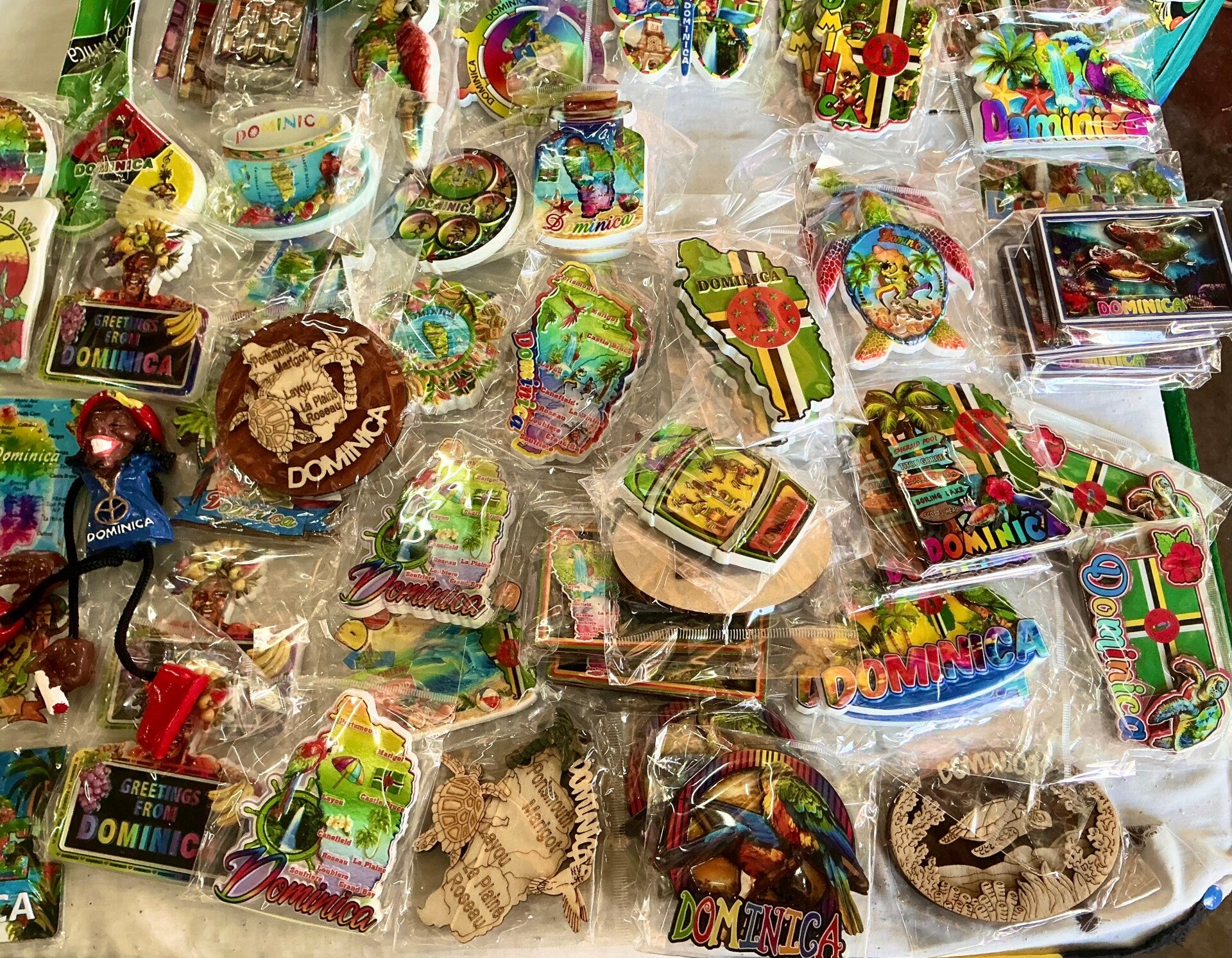 Souvenir fridge magnet featuring a Dominica-themed design