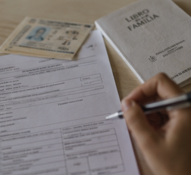 paperwork on table for registering newborn baby in Spain