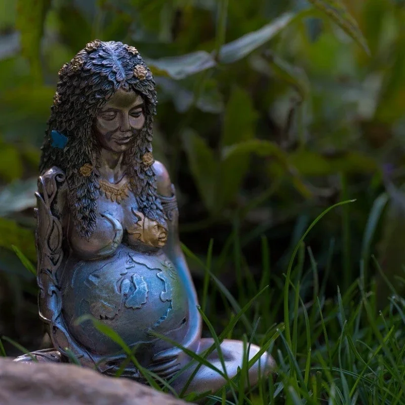 Statue of pregnant woman used in mother blessing circle