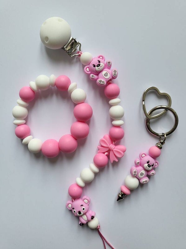 Speenkoord en bijtring met teddybeertje en koalabeertje in fuchsia-roze en wit.