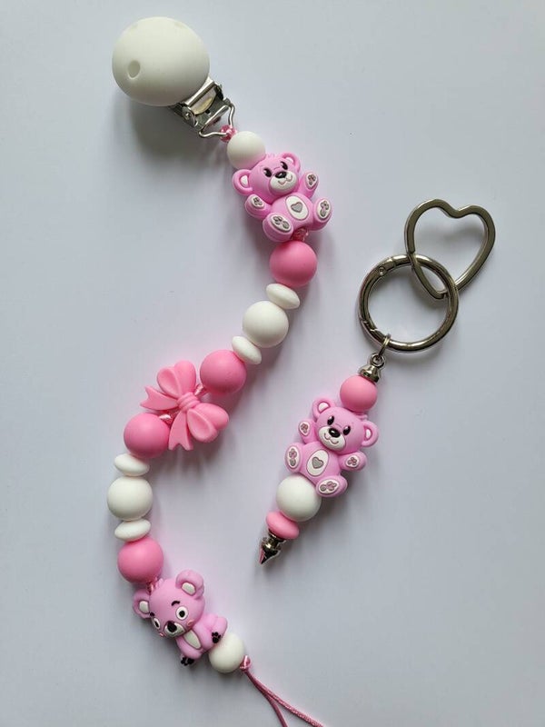 Speenkoord met koalabeertje en teddybeertje in fuchsia-roze en wit.