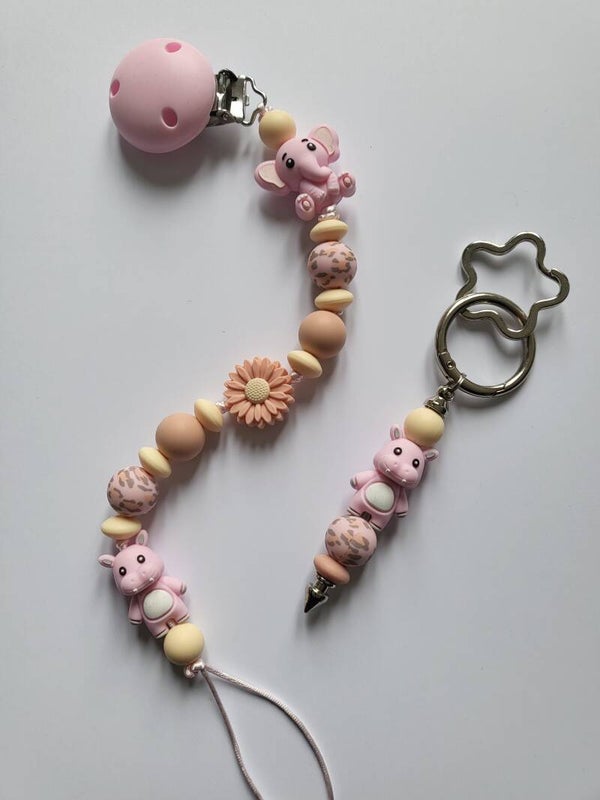 Speenkoord met olifantje en nijlpaardje in roze, zalm en lichtgeel.