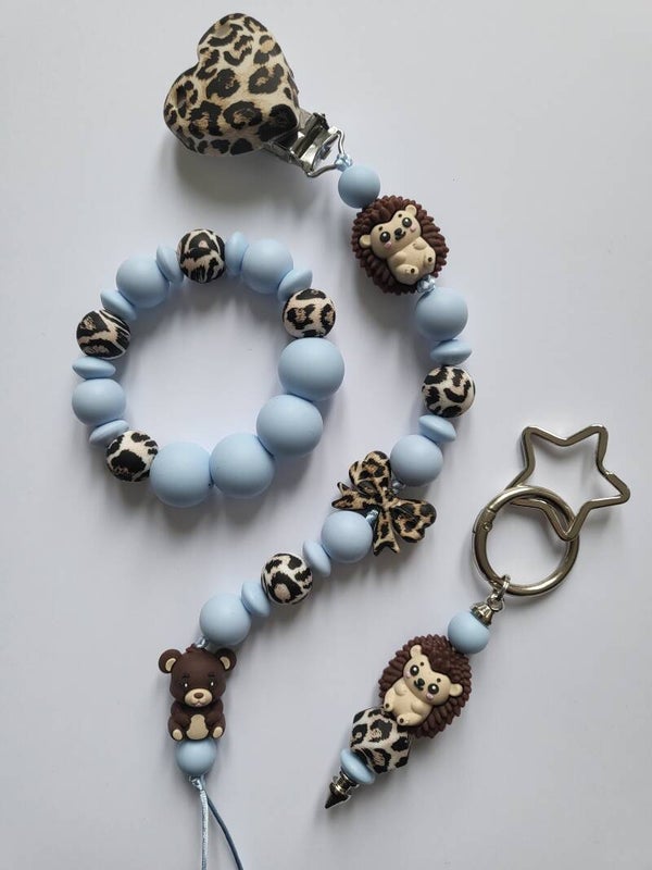 Speenkoord en bijtring met egeltje en beertje in tijgerprint, bruin en blauw.