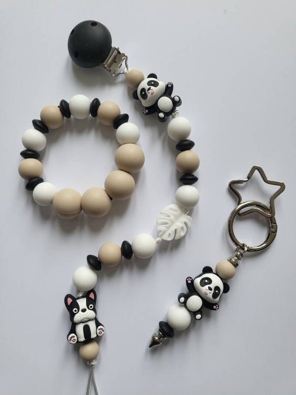 Speenkoord en bijtring met panda-beertje en hondje in zwart, wit en beige.
