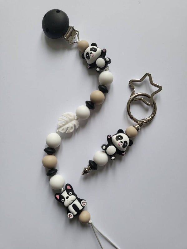 Speenkoord met panda-beertje en hondje in zwart, wit en beige.