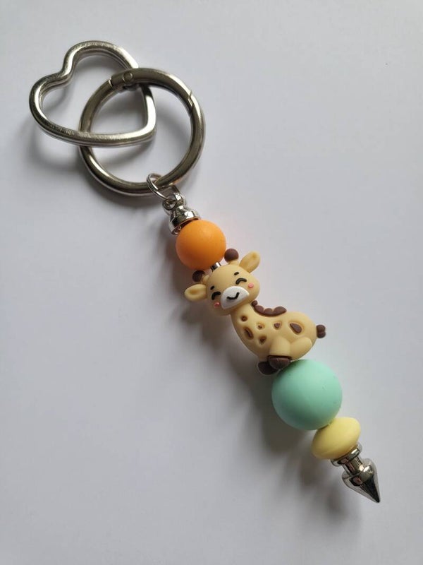 Tashanger met girafje mintgroen, oranje en lichtgeel.