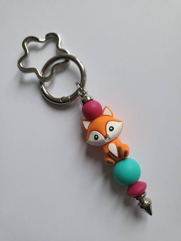 Tashanger met vosje in fuchsia-roze, oranje en turquoise.