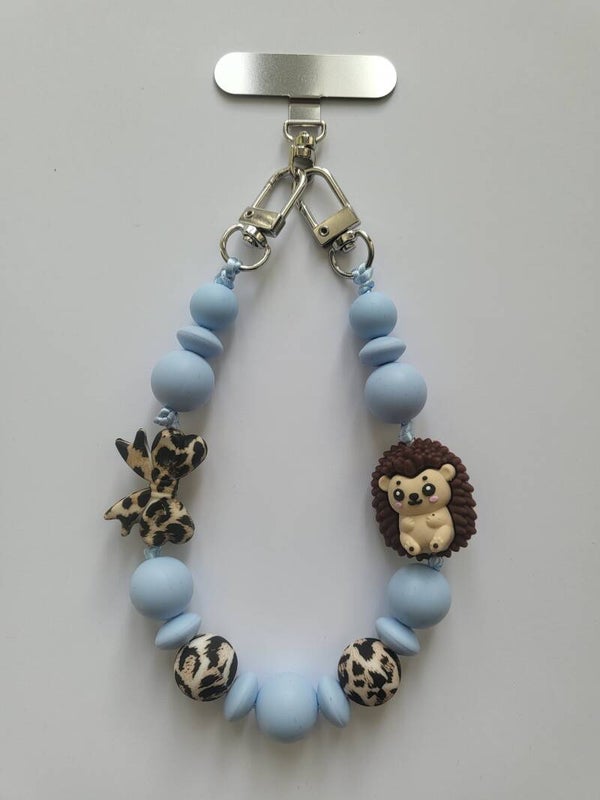 Telefoonkoord met egeltje in tijgerprint, bruin en blauw.