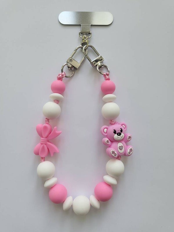 Telefoonkoord met teddybeertje in fuchsia-roze en wit.