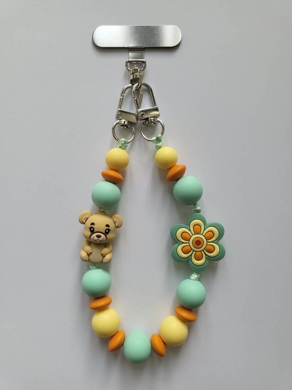Telefoonkoord met beertje in lichtgeel, mintgroen, oranje en beige.