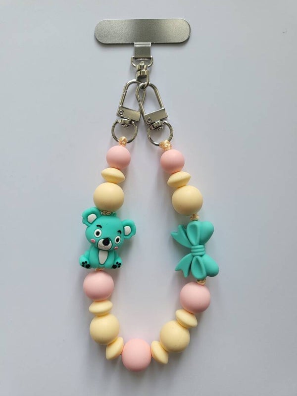 Telefoonkoord met koalabeertje in lichtroze, turquoise en lichtgeel.