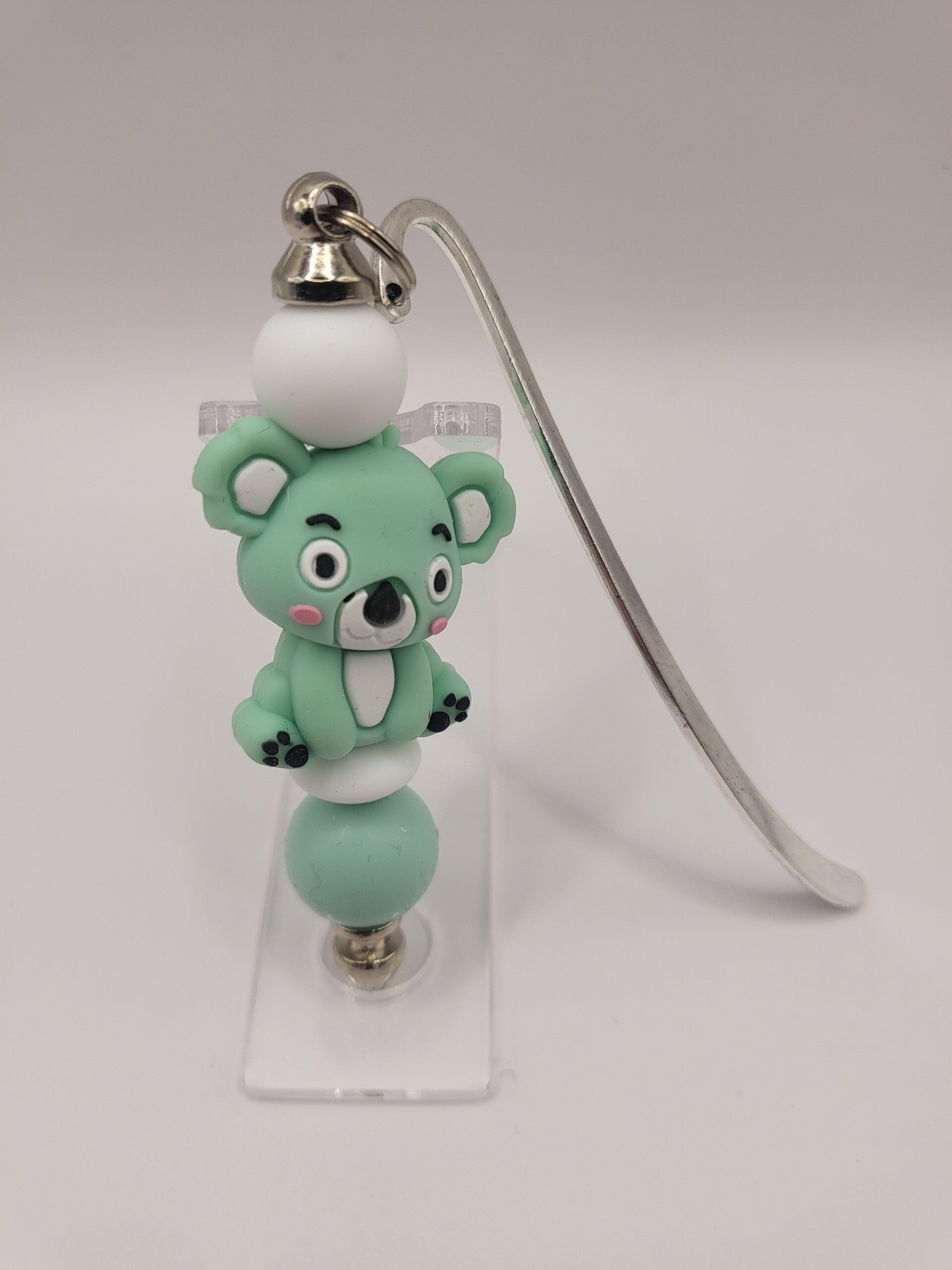Boekenlegger met koalabeertje in mintgroen en wit.