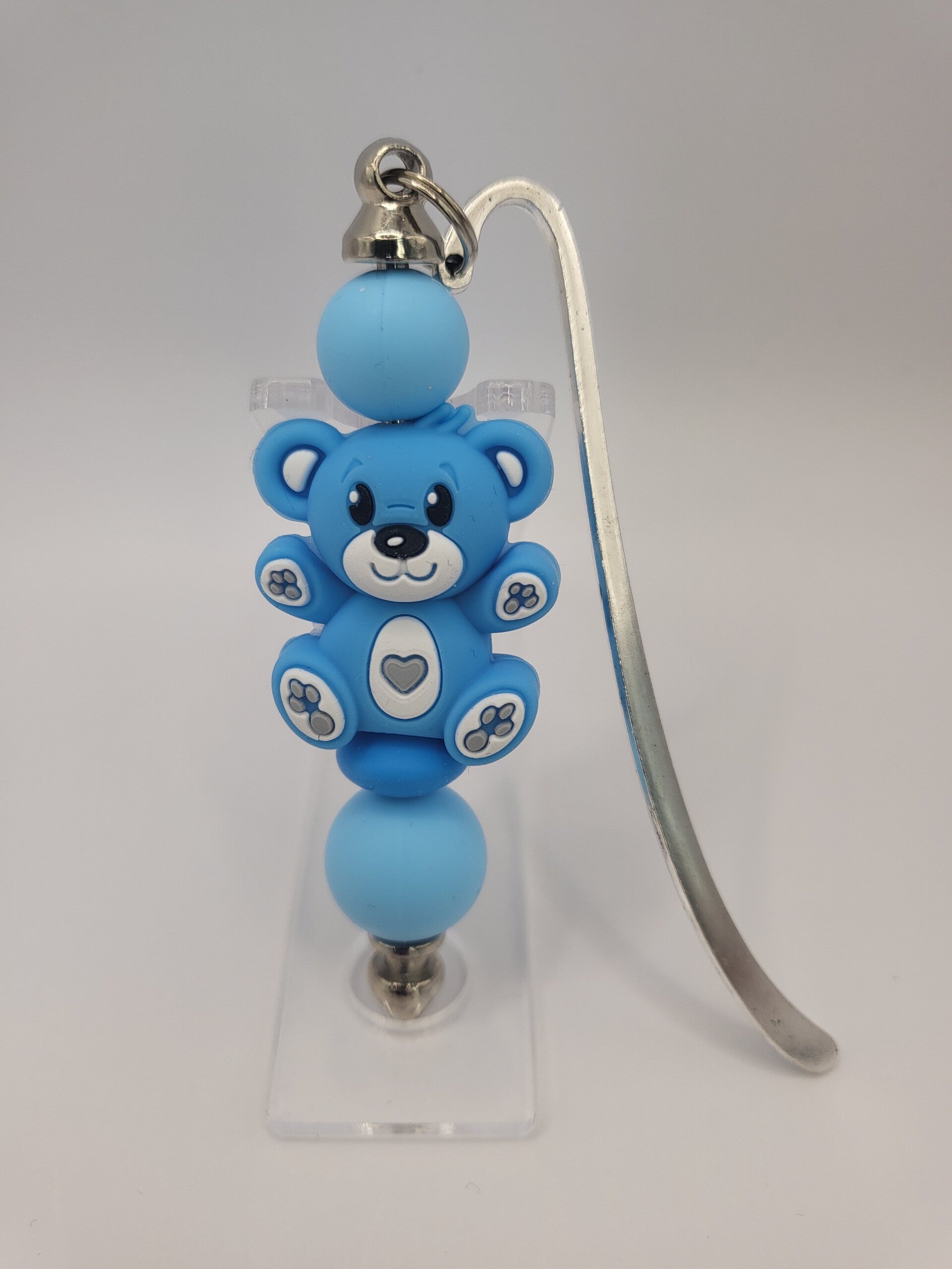 Boekenlegger met teddybeertje in kobaltblauw, zee-blauw en wit.