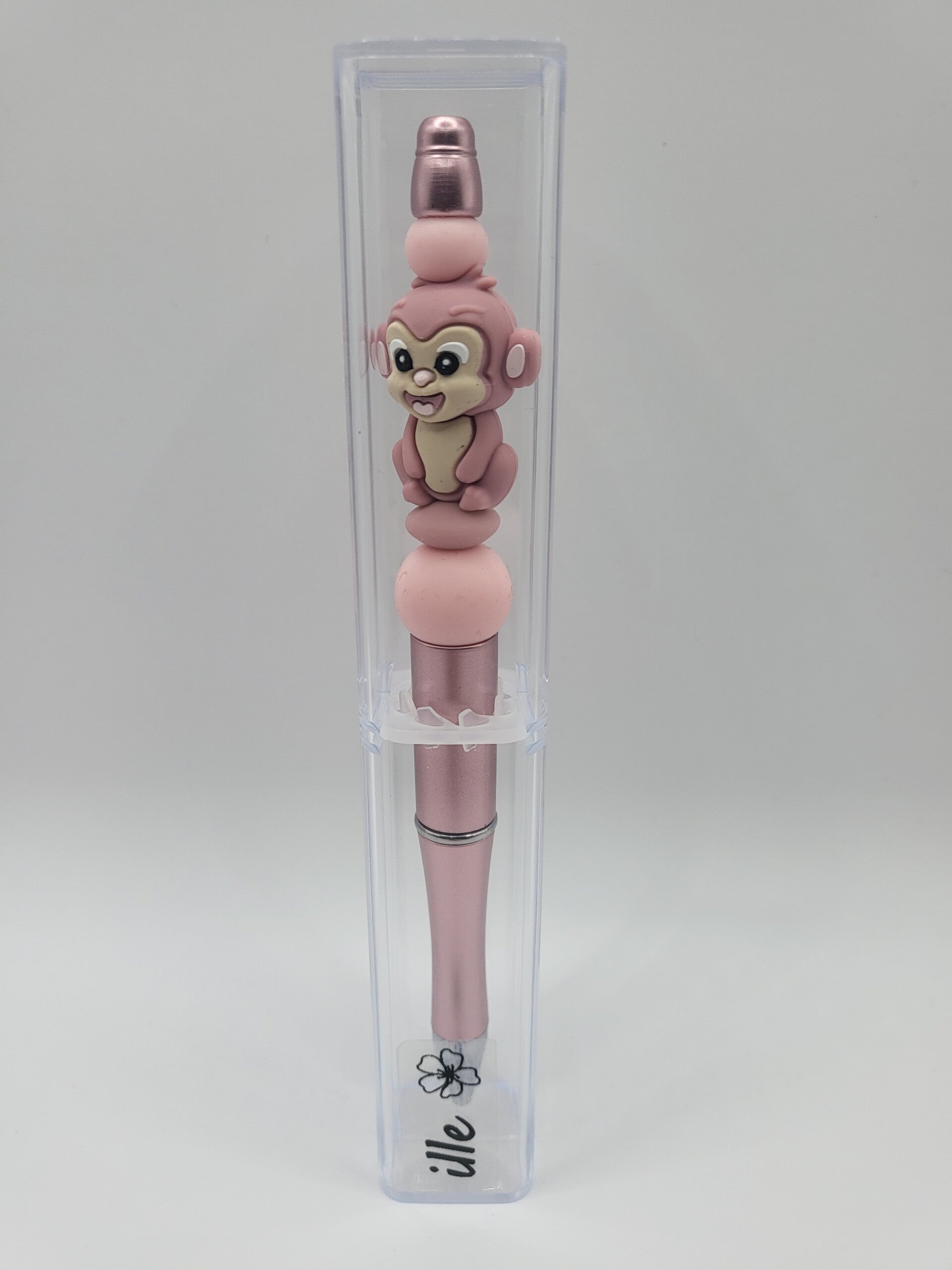 Pen met aapje in roze en oudroze.