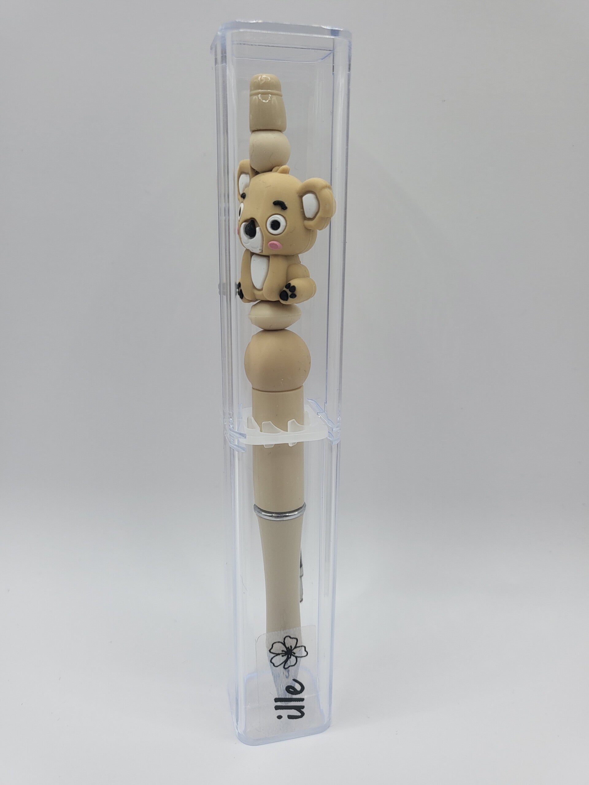 Pen met koala-beertje in zand-kleur en beige.