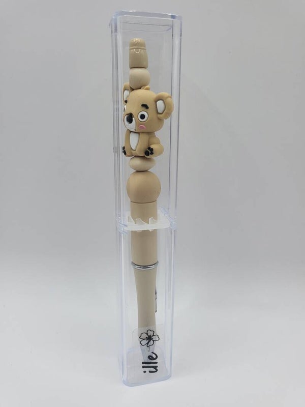 Pen met koala-beertje in zand-kleur en beige.