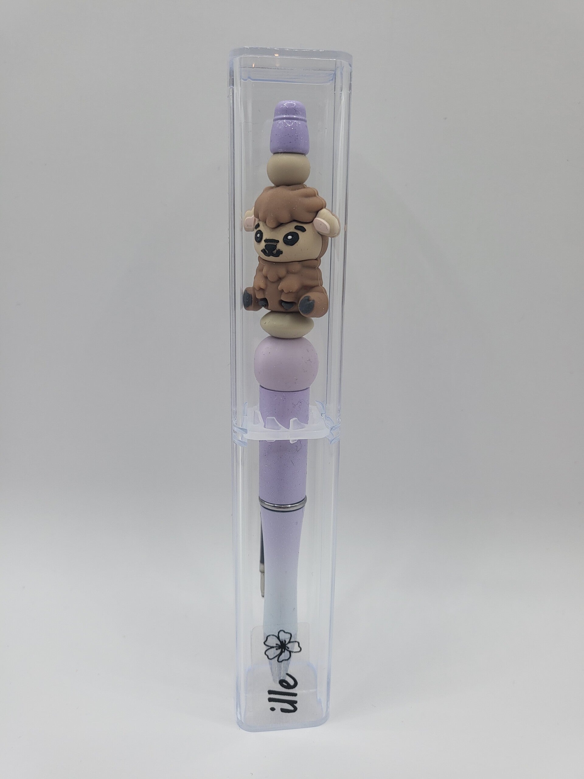Pen met schaapje in licht-lila, beige en bruin.