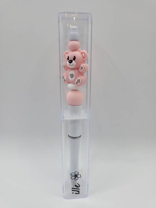 Pen met teddybeertje in lichtroze en wit.