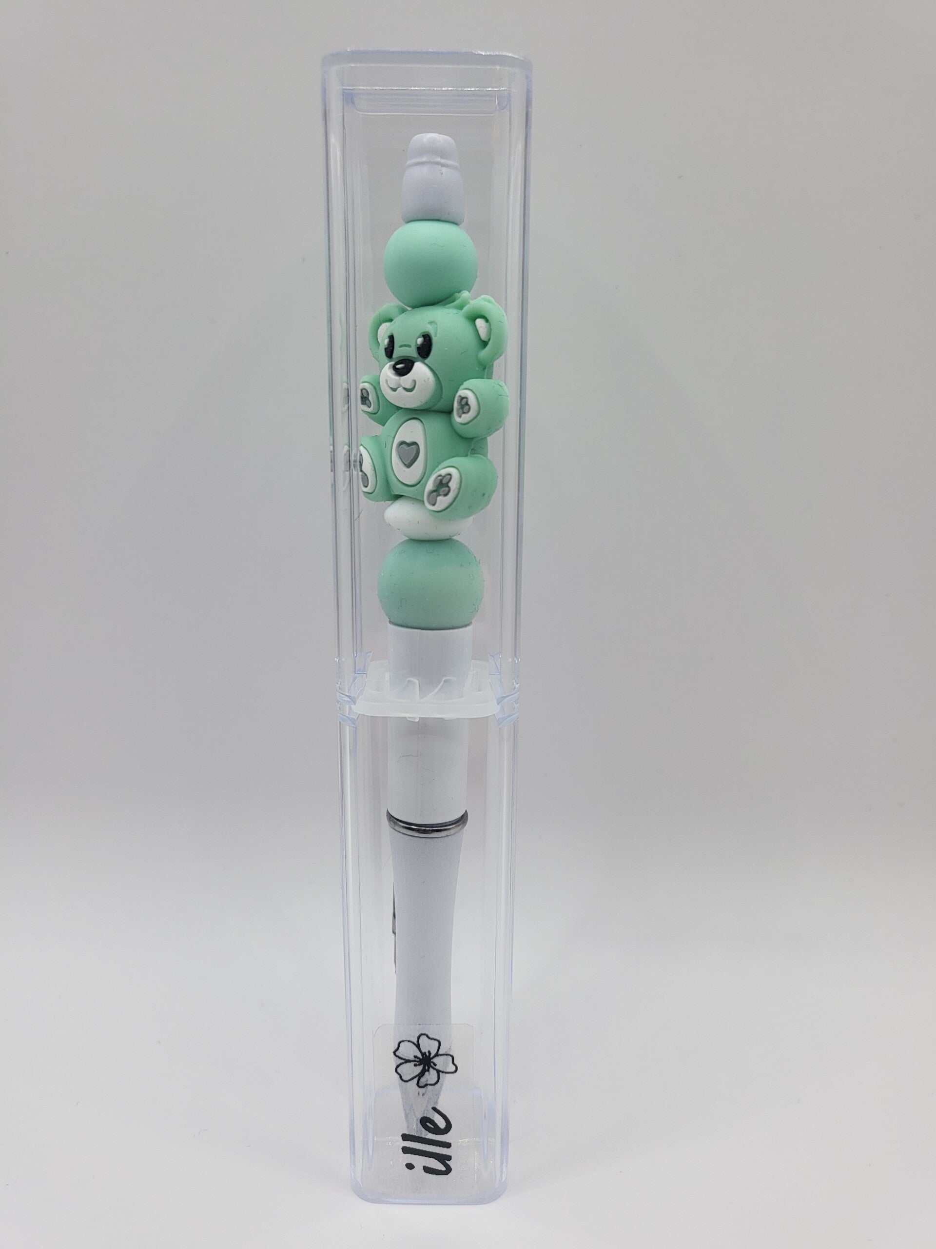 Pen met teddybeertje in mintgroen en wit.