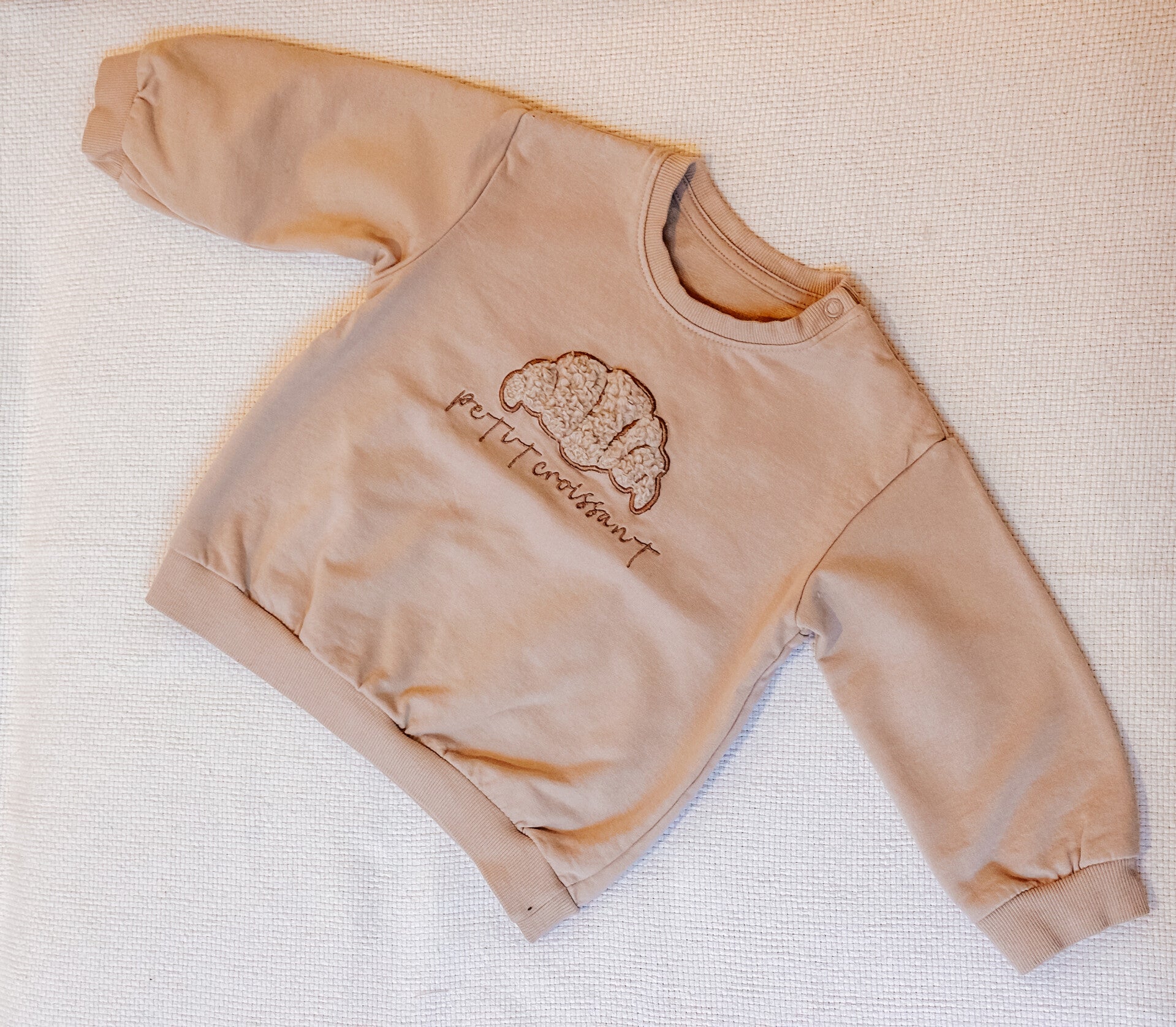 Petit croissant sweater