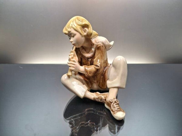 Figurine of boy with a wooden flute A. Santini