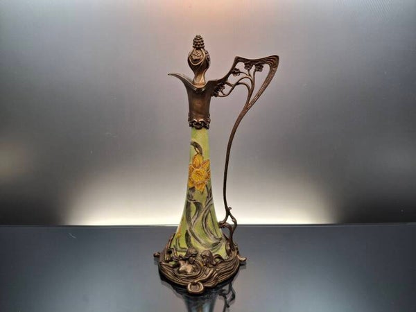 Jug with brass decoration Art nouveau style.