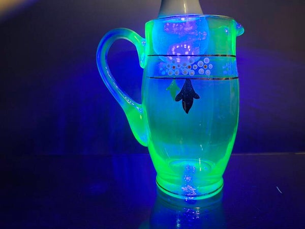 Art deco uranium - blue jug with enamel flowers.