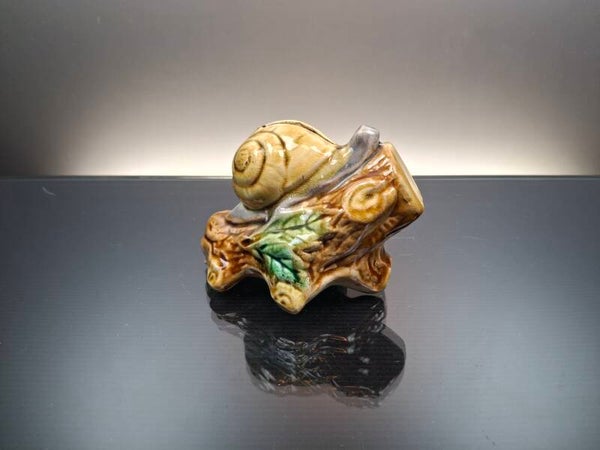 Majolica piggy bank in the shape of a snail