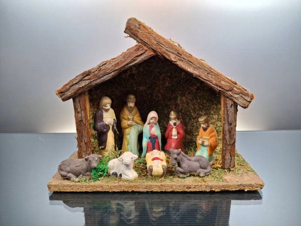 Wooden nativity scene with ceramic figures
