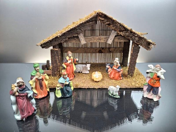 Wooden nativity scene with porcelain figures