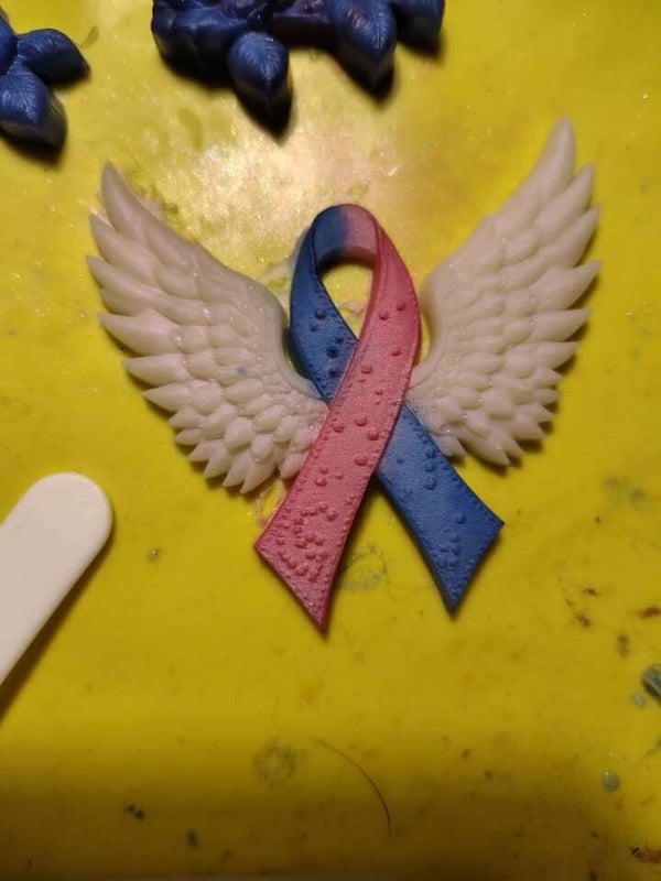 Cancer ribbon with wings