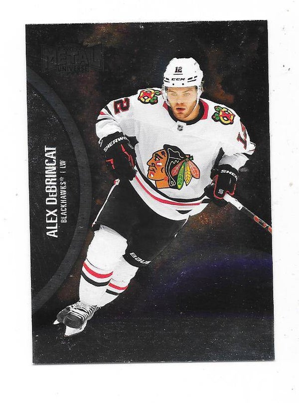 2021-22 SkyBox Metal Universe #17 Alex DeBrincat , Chicago Blackhawks