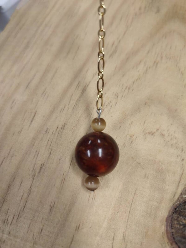 Pendule fait mains
