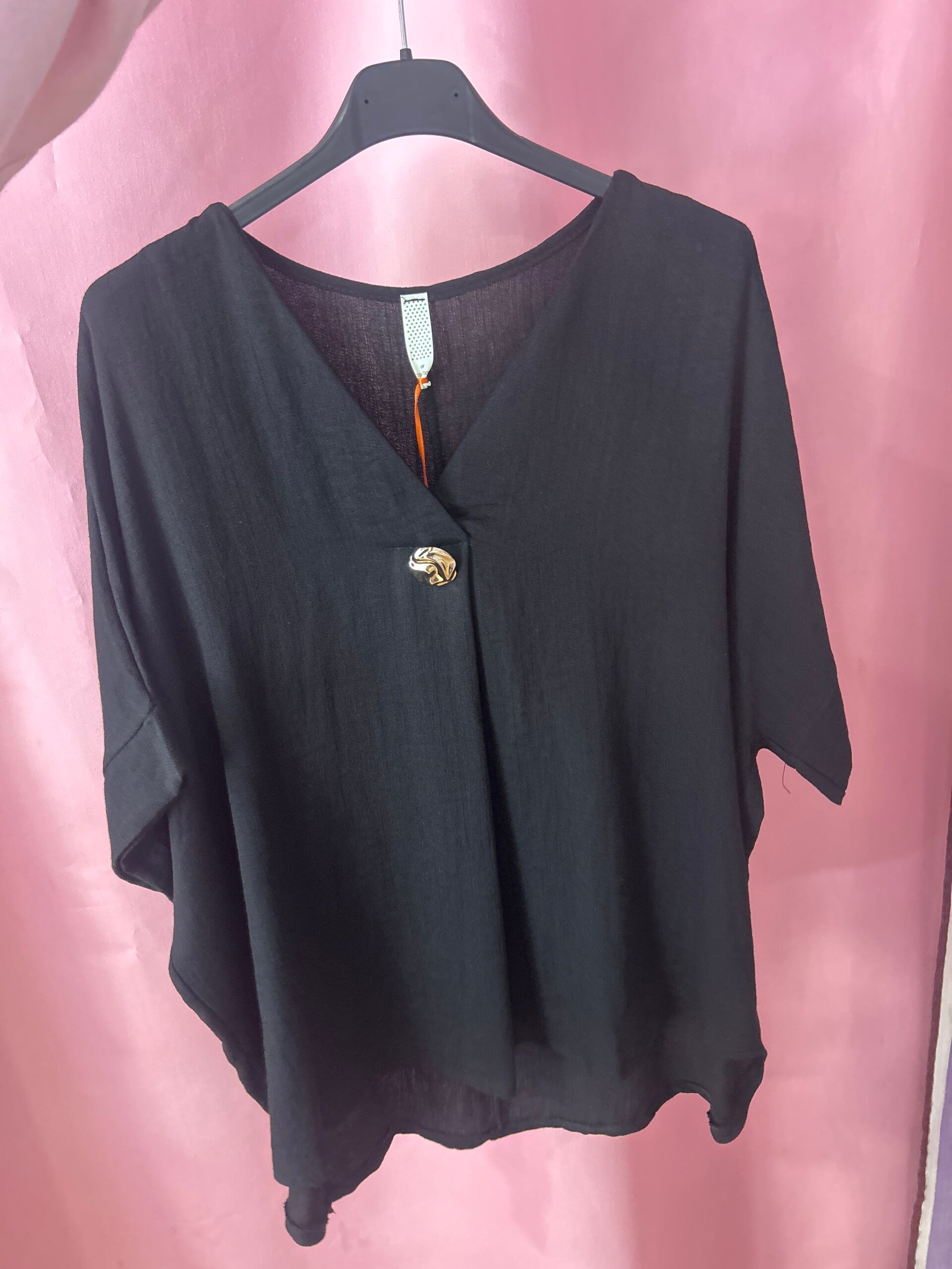Blusa con broche