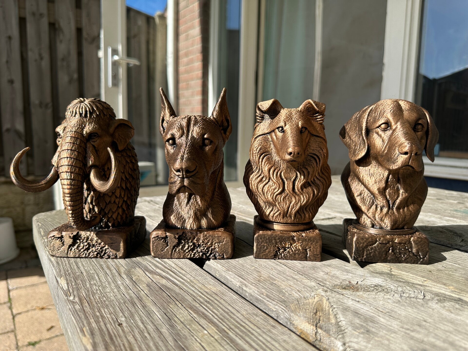 4 gebronsde dierenbeeldjes