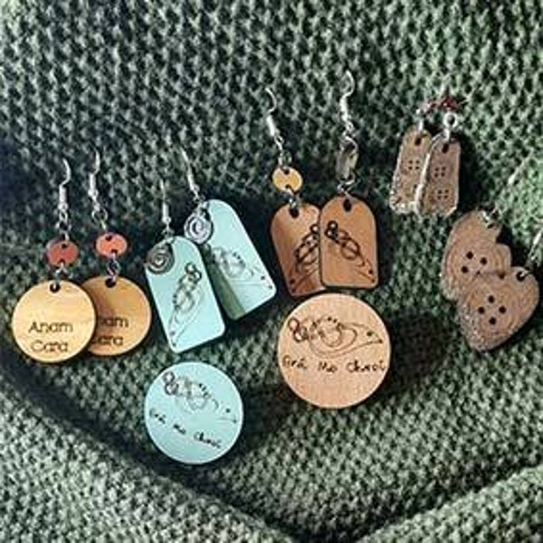 Handcrafted wooden earrings engraved with a celtic design or Irish text.