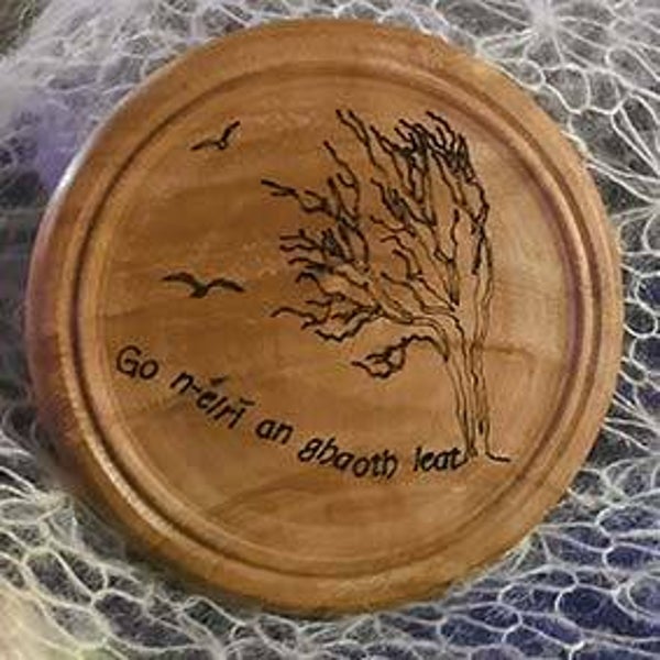 Wood-turned brooches crafted to highlight the natural beauty and individuality of each piece of wood.