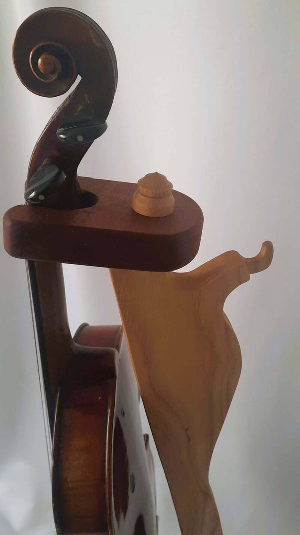 Handmade wood music instrument stands are individually made suit ukuleles, guitars, fiddles and violins.  Each stand is crafted to compliment the shape of the instrument it supports.