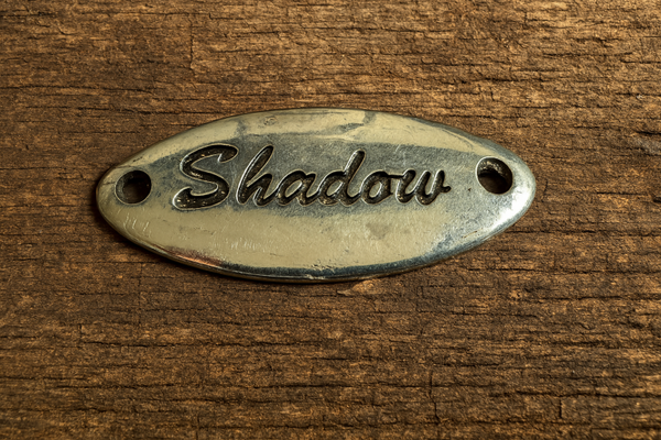 Metalen Plaatje "Shadow" – Verchroomd, Ovaal (5 x 2 cm)