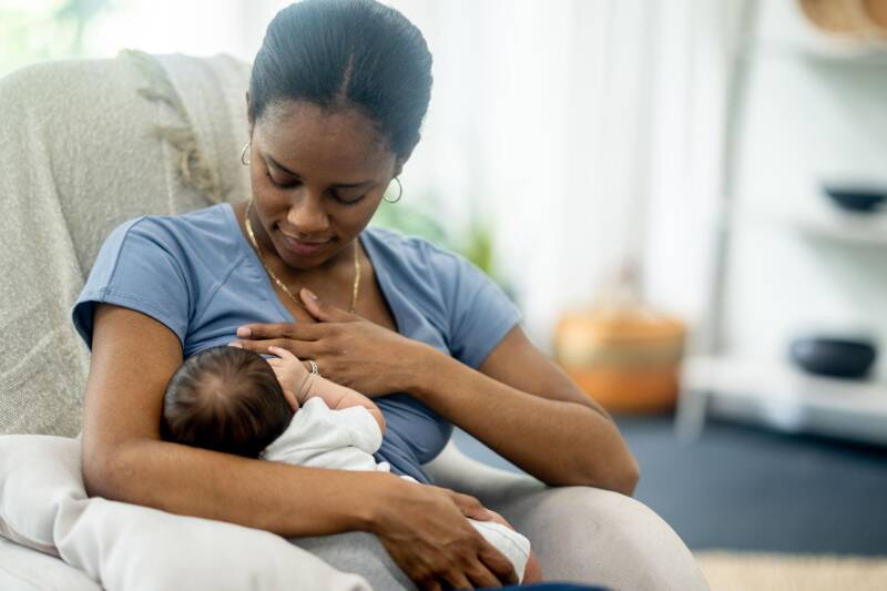 Trusted nanny in Nairobi taking care of a young child in a family home