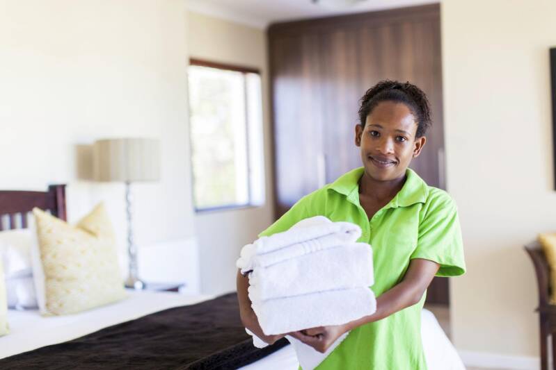 Experienced live-out househelp cleaning a modern Nairobi home during daytime